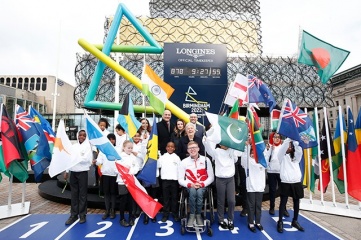 Photo by Miles Willis/Getty Images for Birmingham 2022: (L-R) David Grevemberg, CGF Chief Executive; Ian Reid, Birmingham 2022 CEO; CGF President Dame Louise Martin; Coun. Ian Ward; Athlete Sarah McDonald of Team England; Andy Street, Mayor of the West Midlands; Matthieu Baumgartner, VP Marketing Longines, Gymnast Mimi-Isabella Cesar of Team England; Para-athlete Nathan Maguire of Team England.